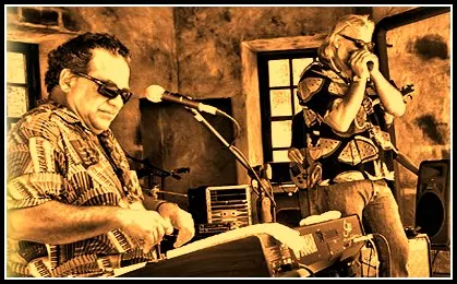 Two men playing the blues on keyboard and harmonica