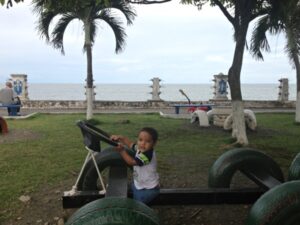 Boy playing on new car built of recycled tires