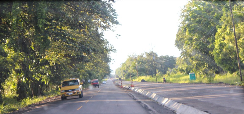 cars are on the 2 lane highway, next to the new 2, but not yet opened, lanes, from Frontera to Puerto Armuelles