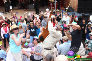 Blues man Lil Ed walking and playing guitar into the crowd