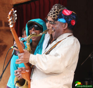 singer, sax player and singer on stage performing