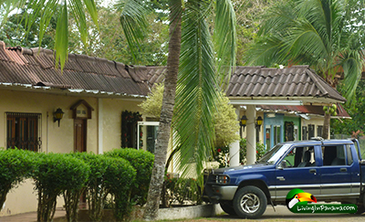 hotel with landscaping and parking in front
