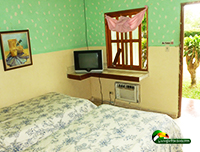 hotel room with 2 beds, TV and AC