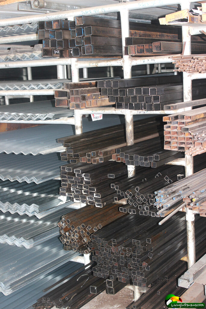 shelves of zinc roofing, rebar, and other metal building supplies