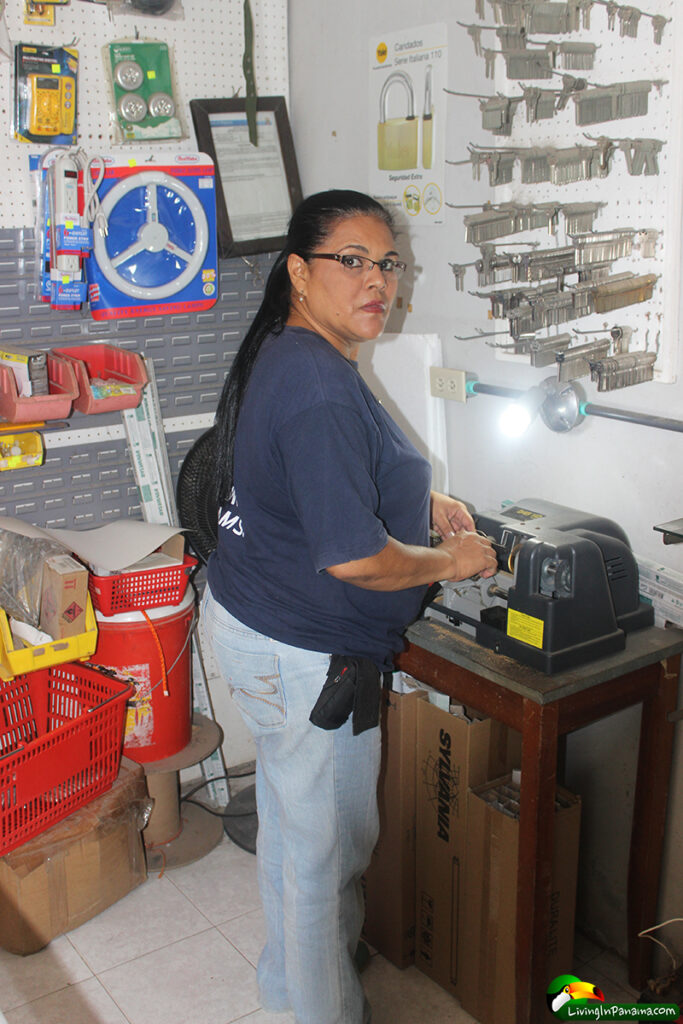 Woman cutting a key in a hardware store in Puerto Armuelles Panama