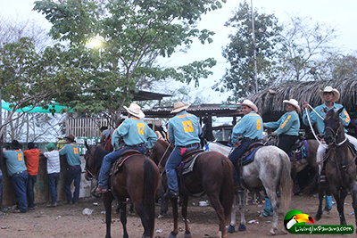 rodeo team on horseback chatting