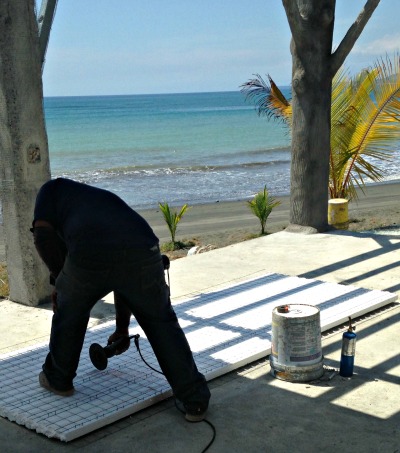 man cutting mesh on M2 panel