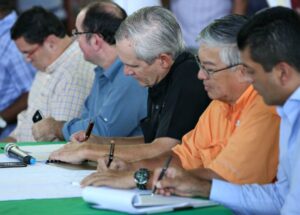 Alvaro Aleman and others signing documents